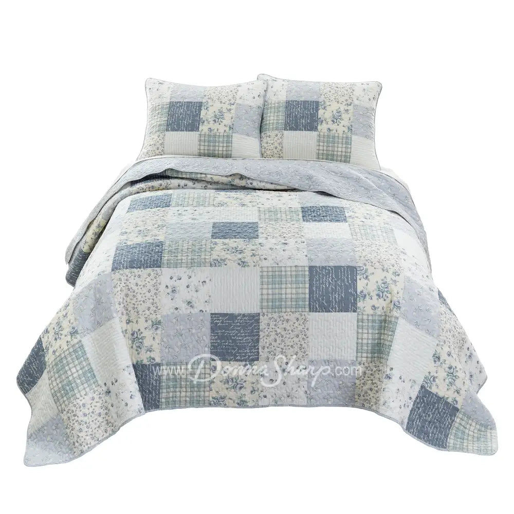 Donna Sharp Blue Pastures cotton patchwork quilt set with soft blues, gentle creams, and crisp white floral and plaid blocks