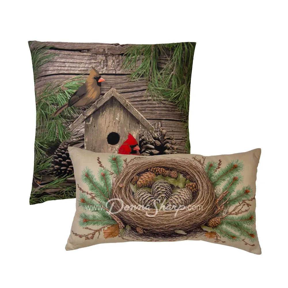 Cardinal Pine Pillow Set Two decorative pillows with nature-themed designs featuring birds and a birdhouse.