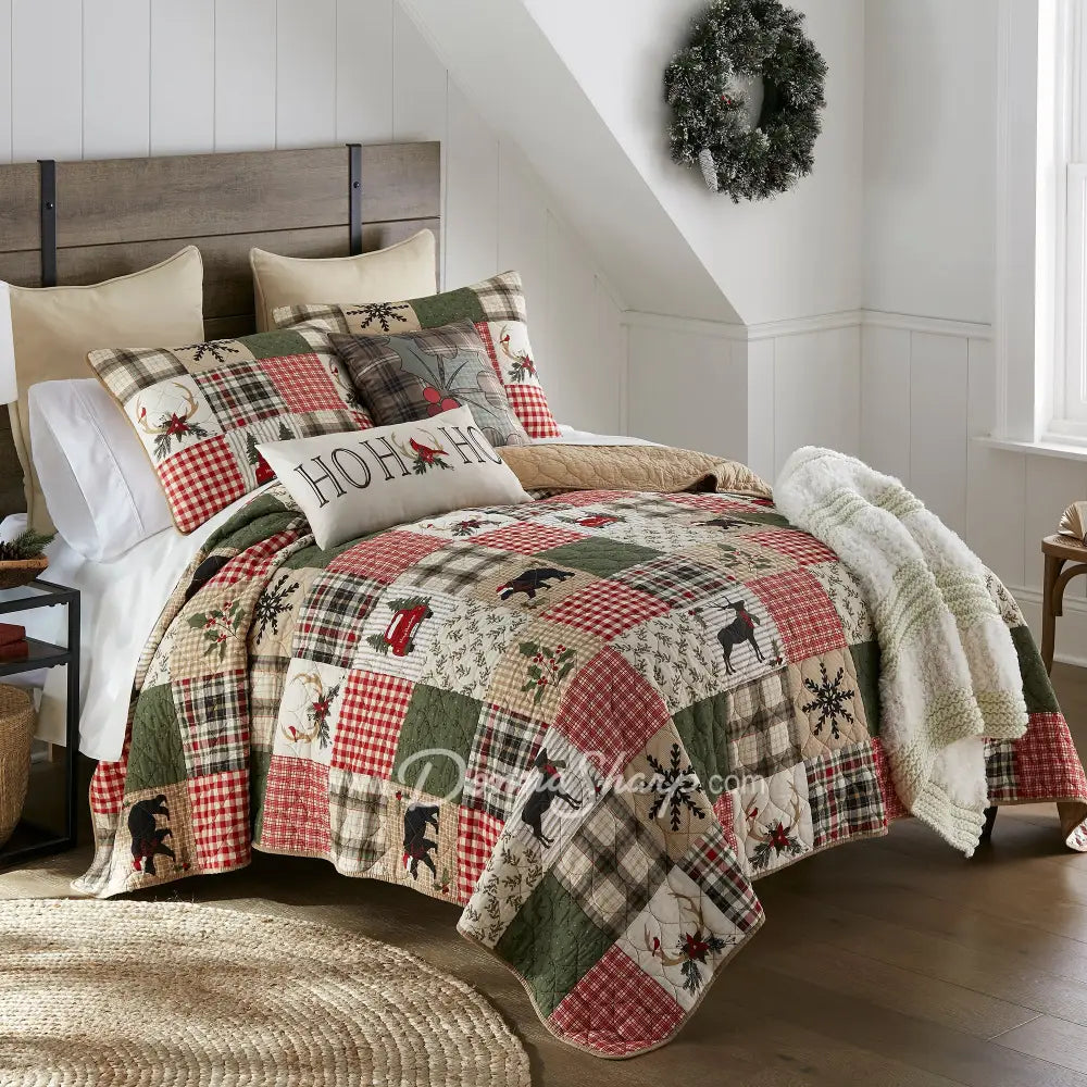 Holly Forest Cotton Pieced Quilt Set Holiday quilt angle image in holiday themed bedroom