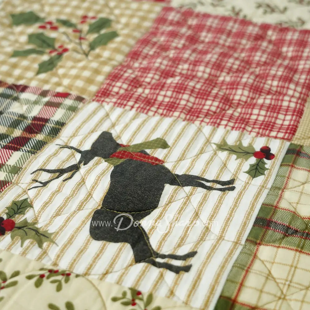 Holly Forest Cotton Pieced Quilt Set Holiday themed bedding closeup of deer and plaid quilt squares