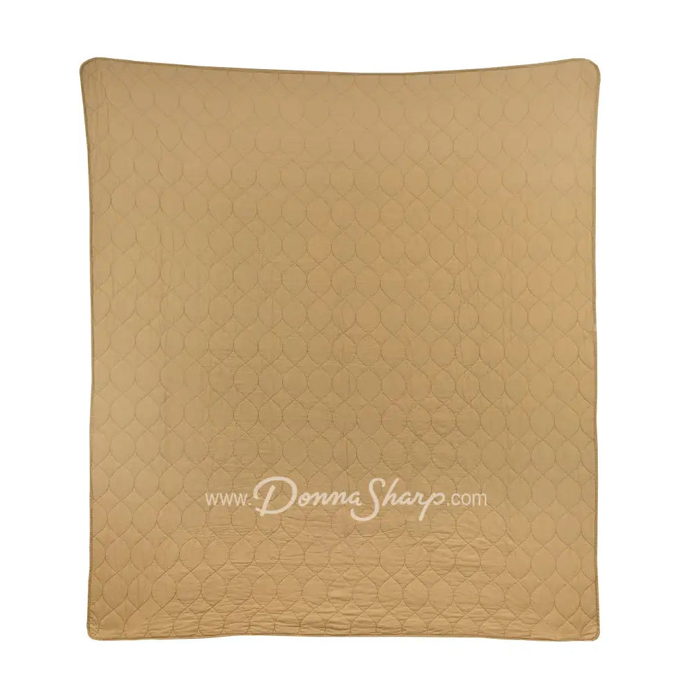 Holly Forest Cotton Pieced Quilt Set Holiday reverse is a tan color with oval stitching