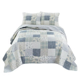 Donna Sharp Blue Pastures cotton patchwork quilt set with soft blues, gentle creams, and crisp white floral and plaid blocks