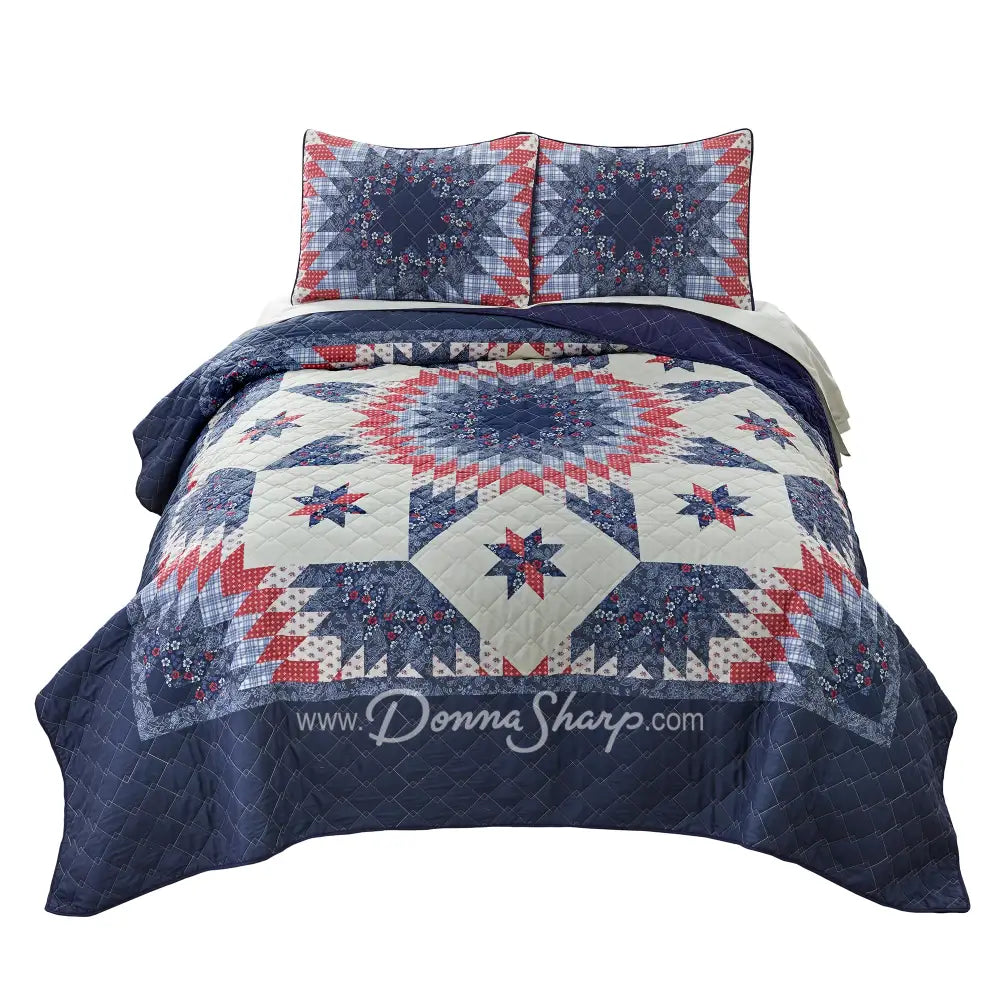 Donna Sharp Bluefield Star quilt set with navy floral border, country blue, periwinkle, pale ivory, rose, and raspberry Lone Star pattern, and matching pillow shams