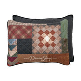 Donna Sharp Greenwood Patch reversible pillow shams showing patchwork front with greens ranging from sage to deep olive, warm browns, muted terracotta, hints of denim and spruce blue, and aged parchment ivories and tan plaid, chevron and pine cone patterns, and solid charcoal back