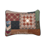 Donna Sharp Greenwood Patch reversible pillow shams showing patchwork front with greens ranging from sage to deep olive, warm browns, muted terracotta, hints of denim and spruce blue, and aged parchment ivories and tan plaid, chevron and pine cone patterns