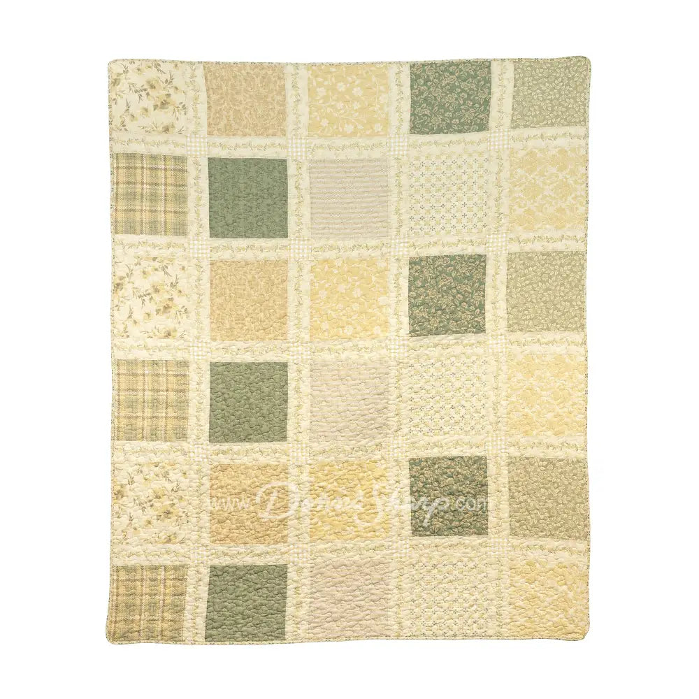Donna Sharp Meadow cotton patchwork throw blanket in soothing shades of sage green, beige, white, buttercream gold, and cream with floral fabric blocks
