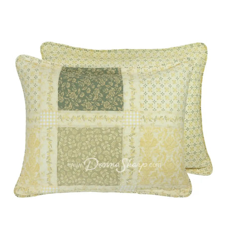 Donna Sharp Meadow reversible cotton pillow shams showing patchwork front in soothing shades of sage green, beige, white, buttercream gold, and cream, and a  lattice print back