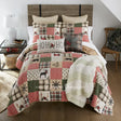 Holly Forest Cotton Pieced Quilt Set King Set Holiday themed bedding with decorative pillows and throw blanket on bed