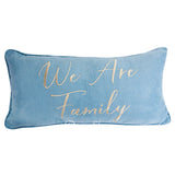 Blue pillow with 'We Are Family' text in gold on a white background