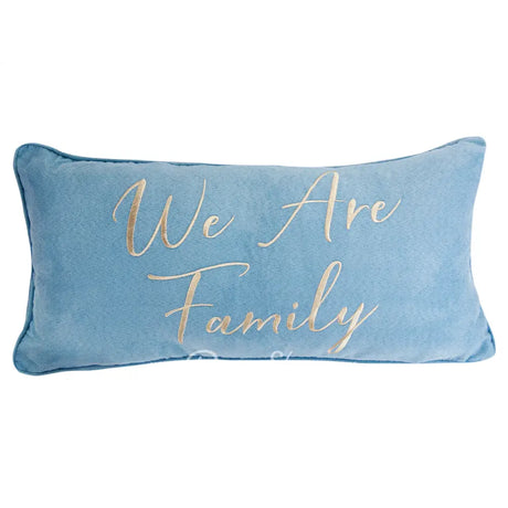 Blue pillow with 'We Are Family' text in gold on a white background